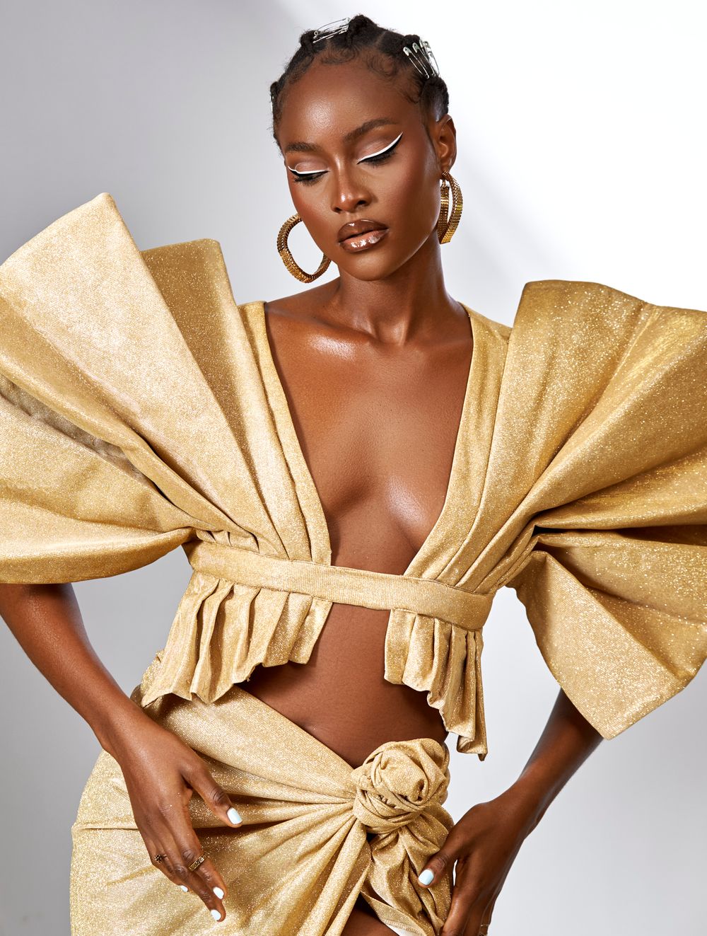 Model in a gold couture outfit
