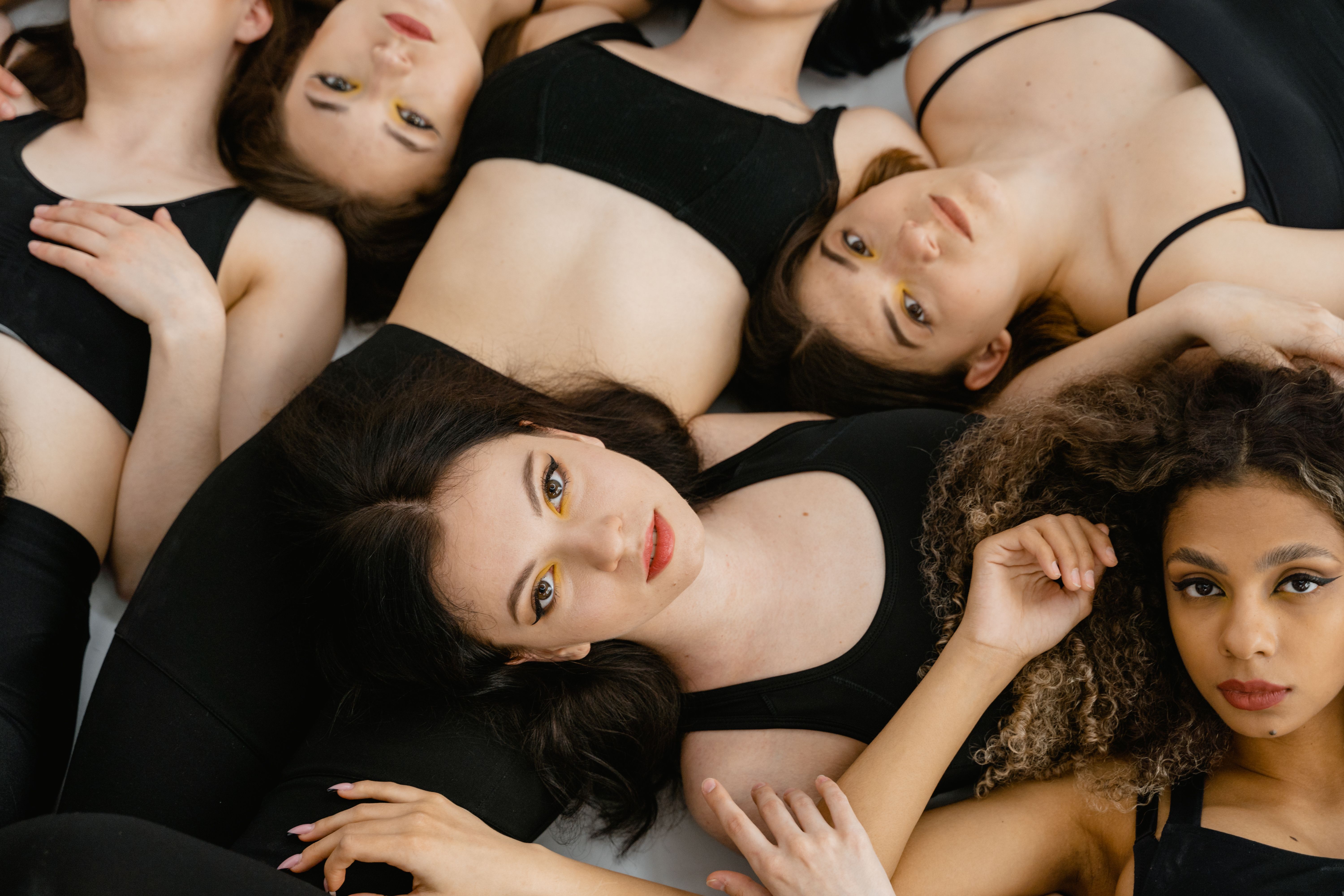 A group of models laying together in the studio